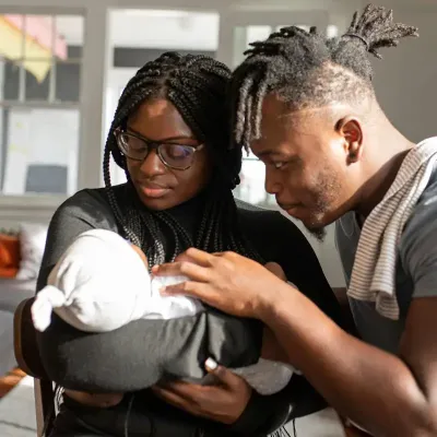 couple coping with demands of newborn baby